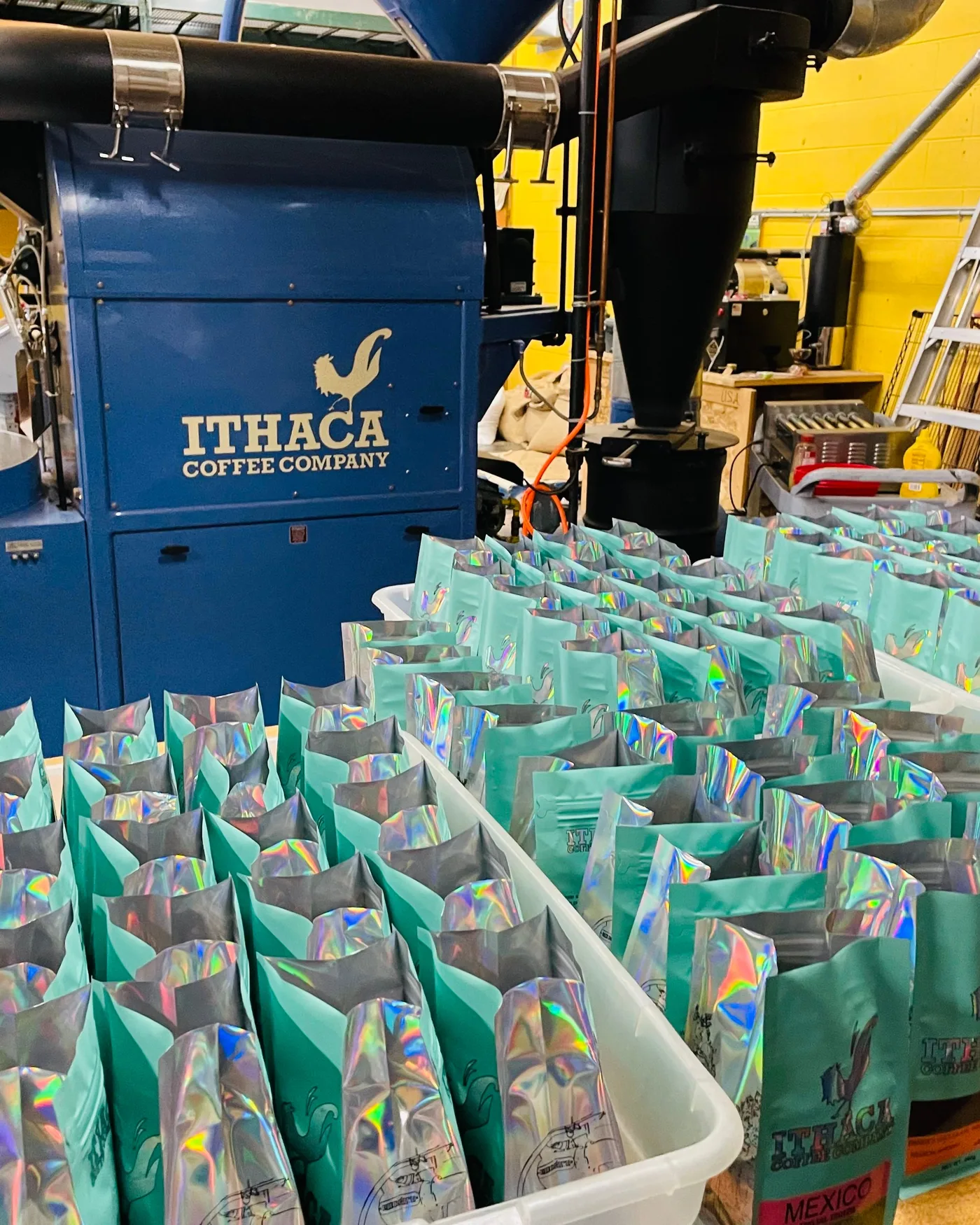 Bags of coffee packed beside the roaster